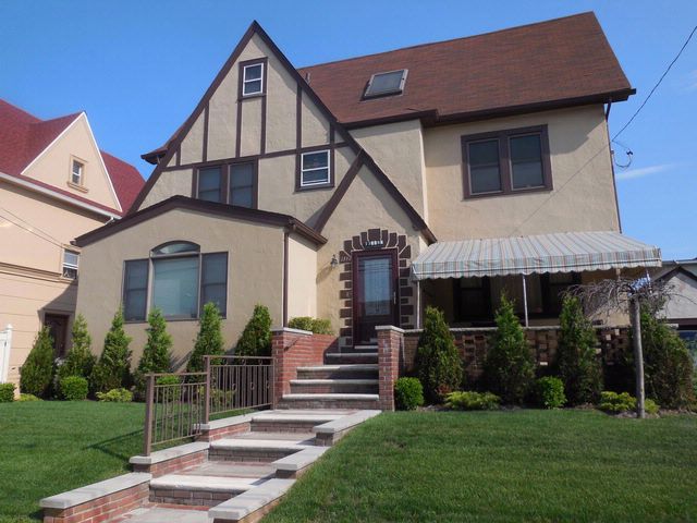  5 BR,  3.50 BTH  Tudor style home in Belle Harbor